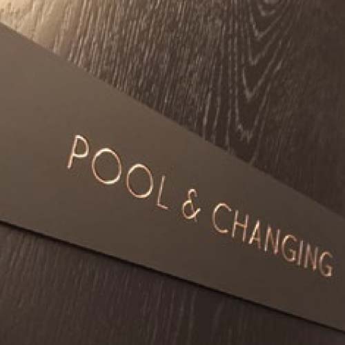 city-suites-pool-and-changing-room-wall-sign